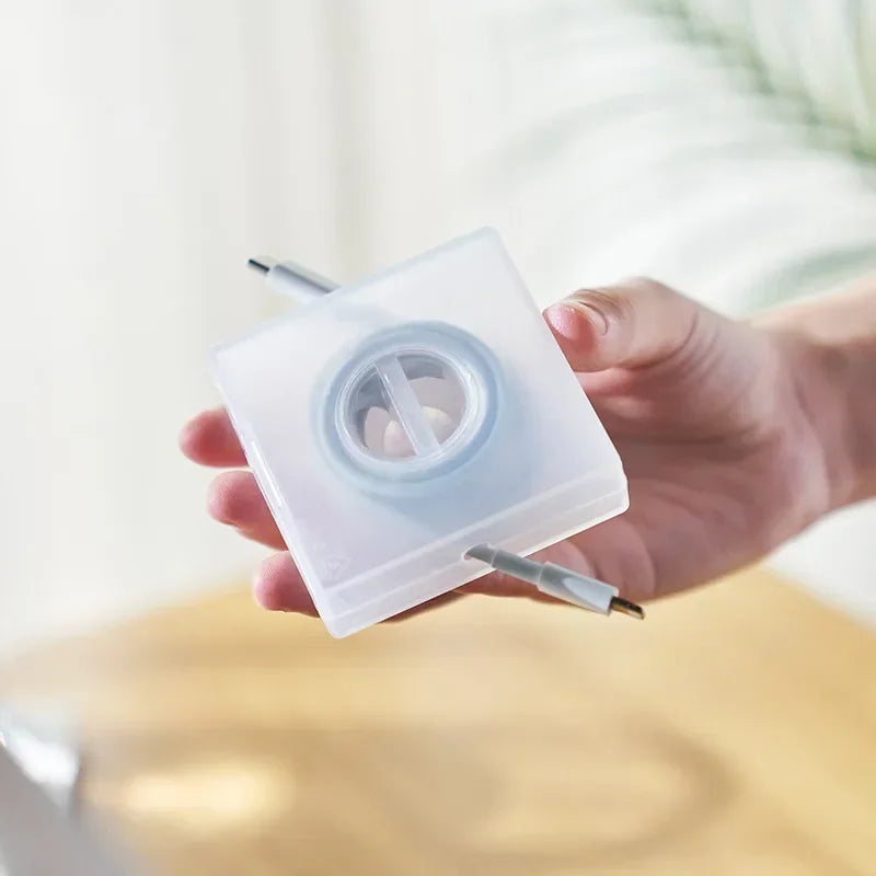 CableNest™ – Transparent Cord Organizer & Phone Stand