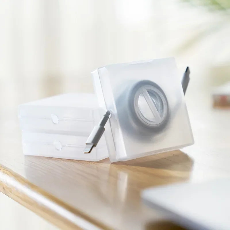 CableNest™ – Transparent Cord Organizer & Phone Stand